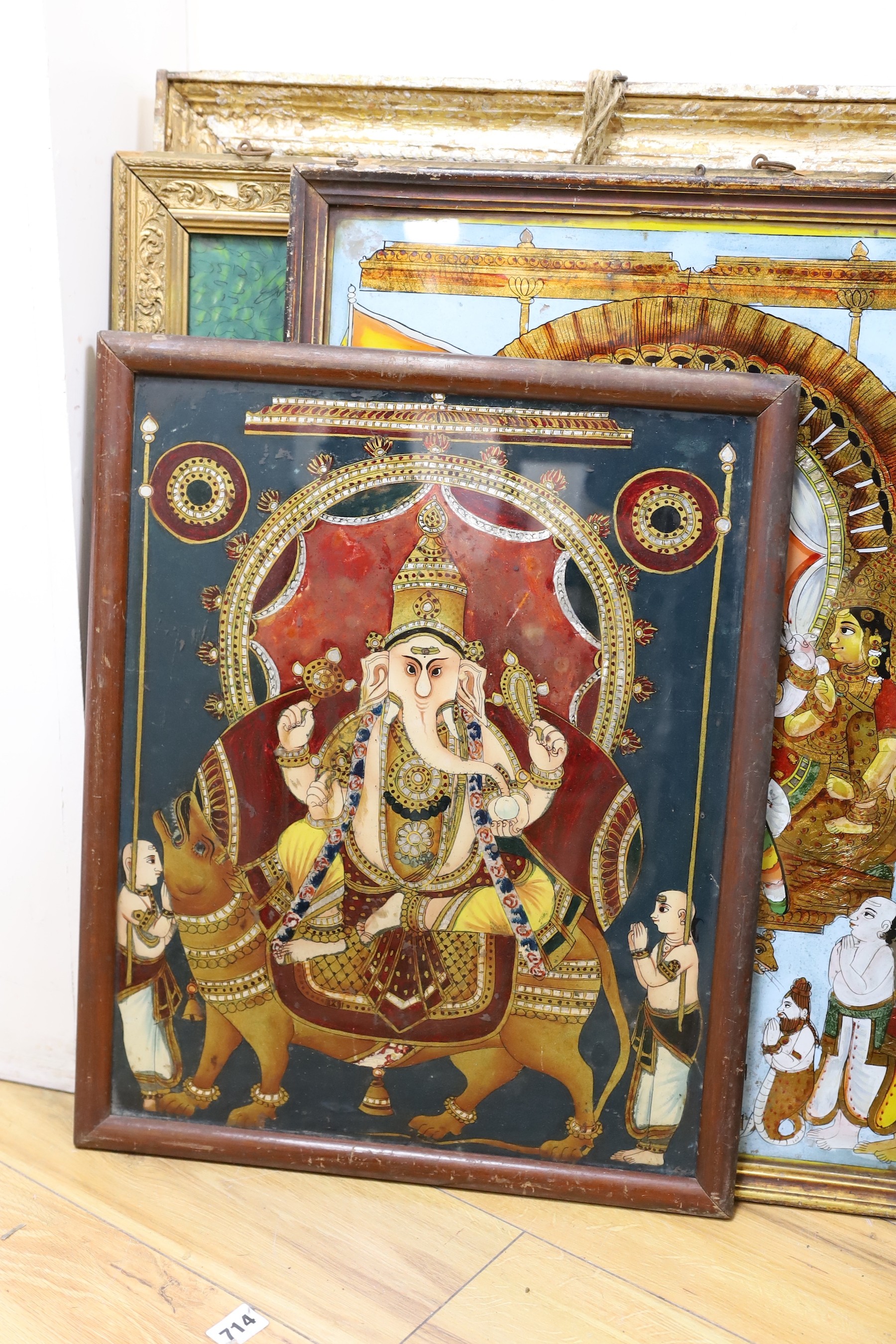 A collection of eight Indian reverse decorated glass pictures, 20th century, largest frame 70cm X 60cm
